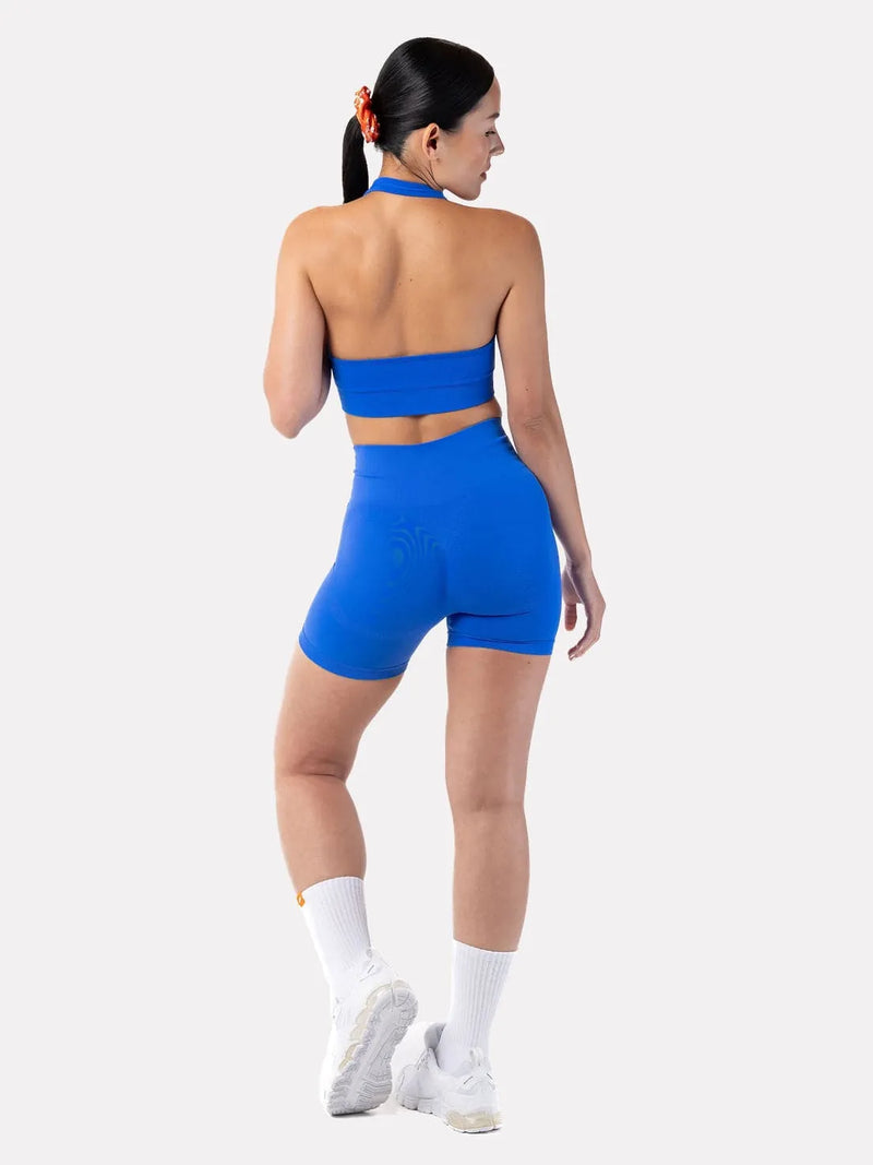 Back view of blue fitness outfit on model